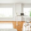 white and black area rug on brown wooden floor